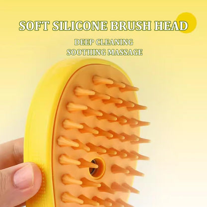 Soft silicone brush head on a yellow pet grooming tool